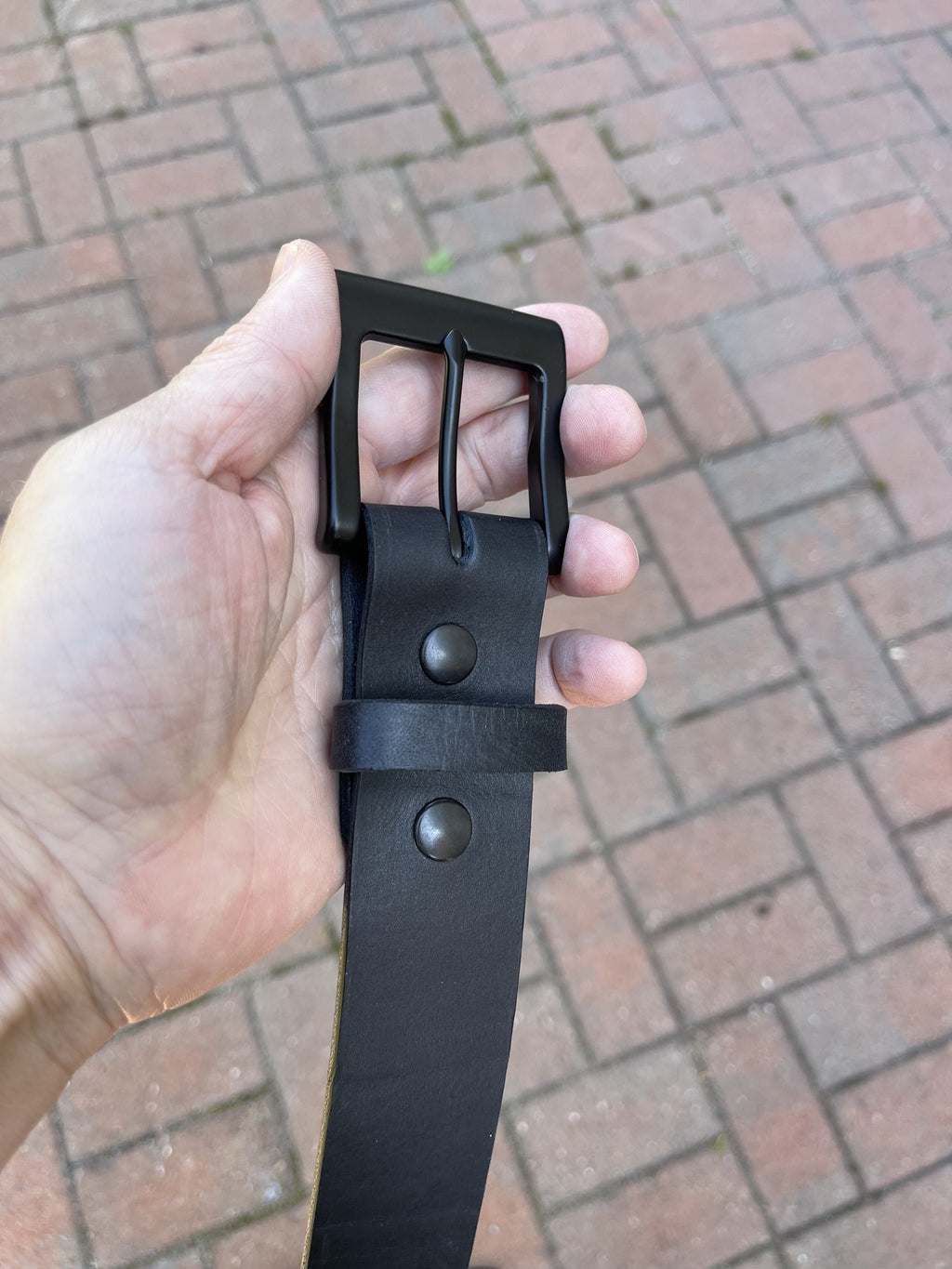 Black leather belt keeper and snap detail