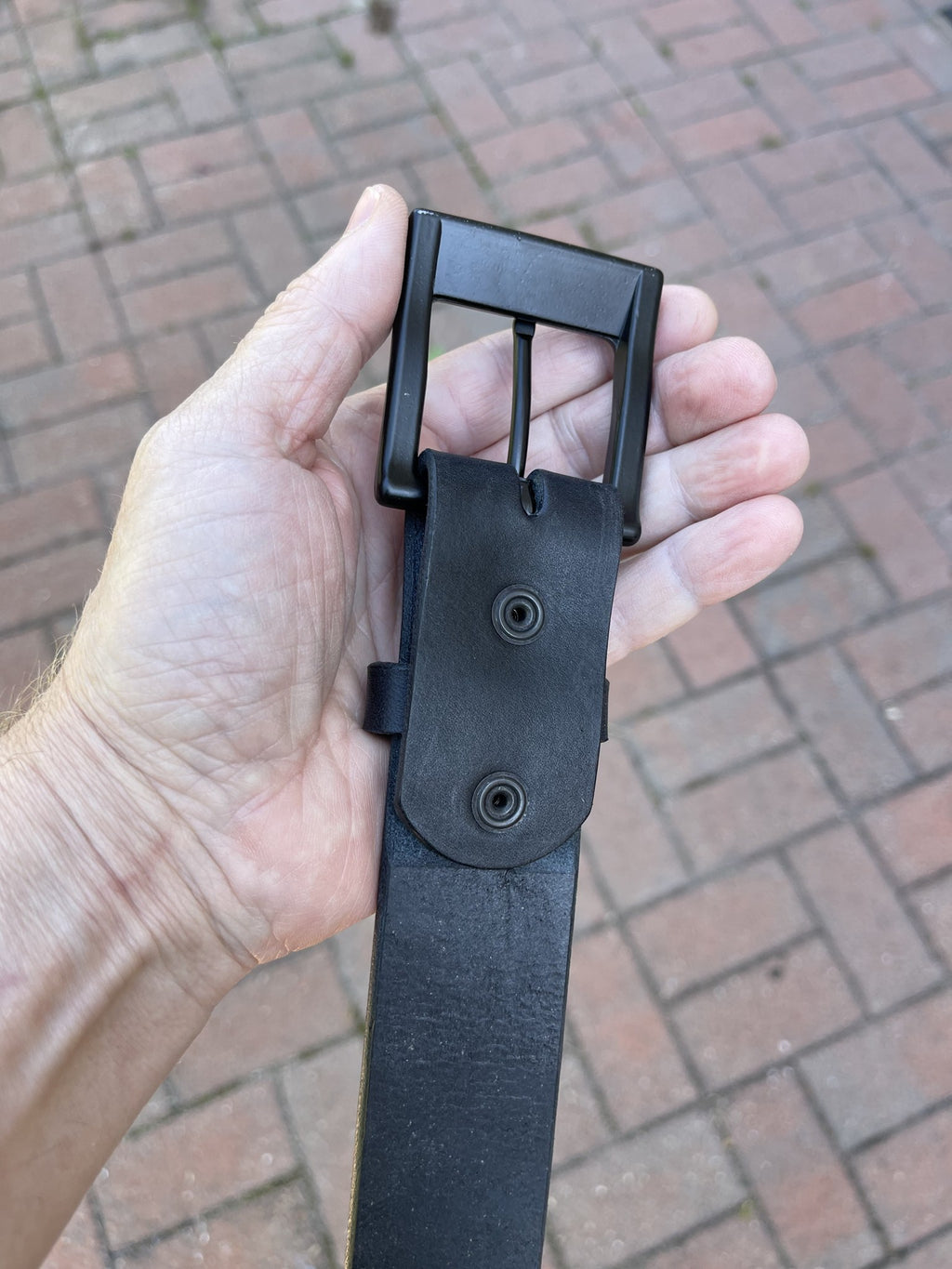 Back of the black belt fold showing the snap-on buckle attachment
