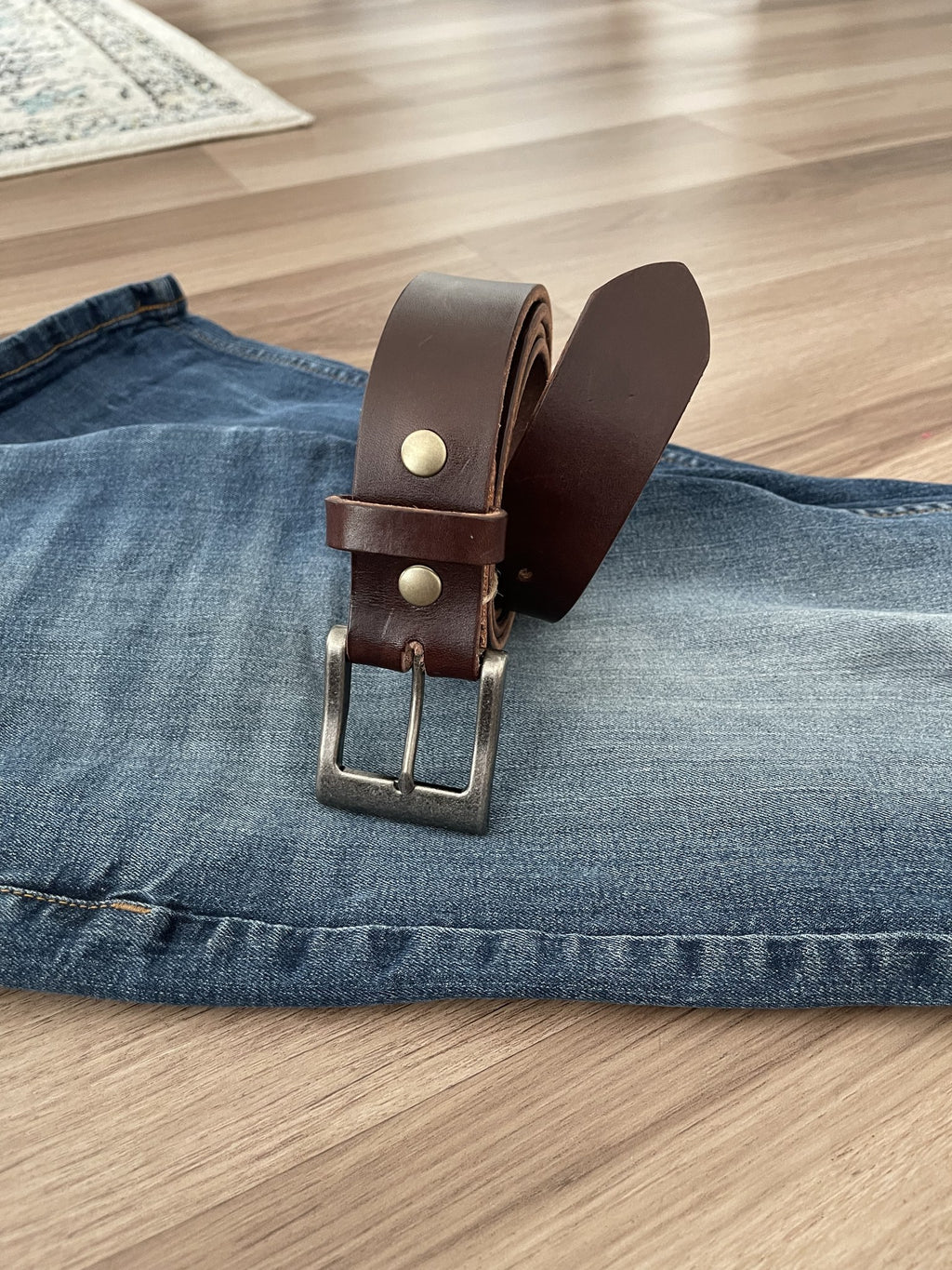 Havana Brown Hermann Oak belt standing on denim
