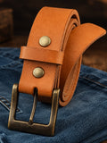 London Tan English Bridle leather belt with antique brass buckle on denim